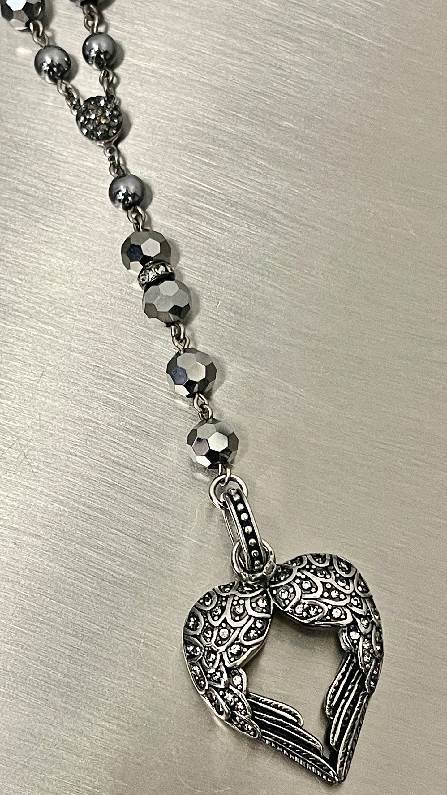 “Sacred Wings” in Gunmetal
