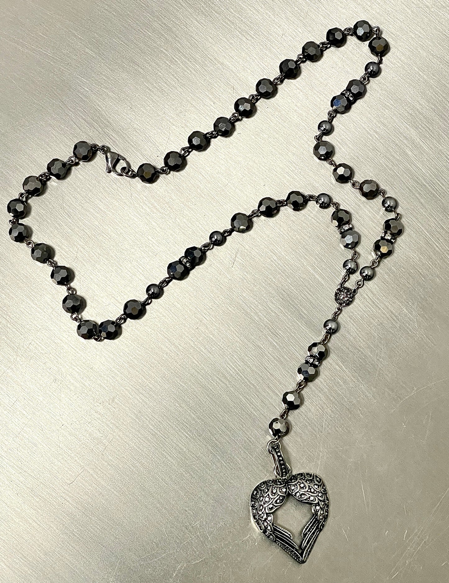 “Sacred Wings” in Gunmetal