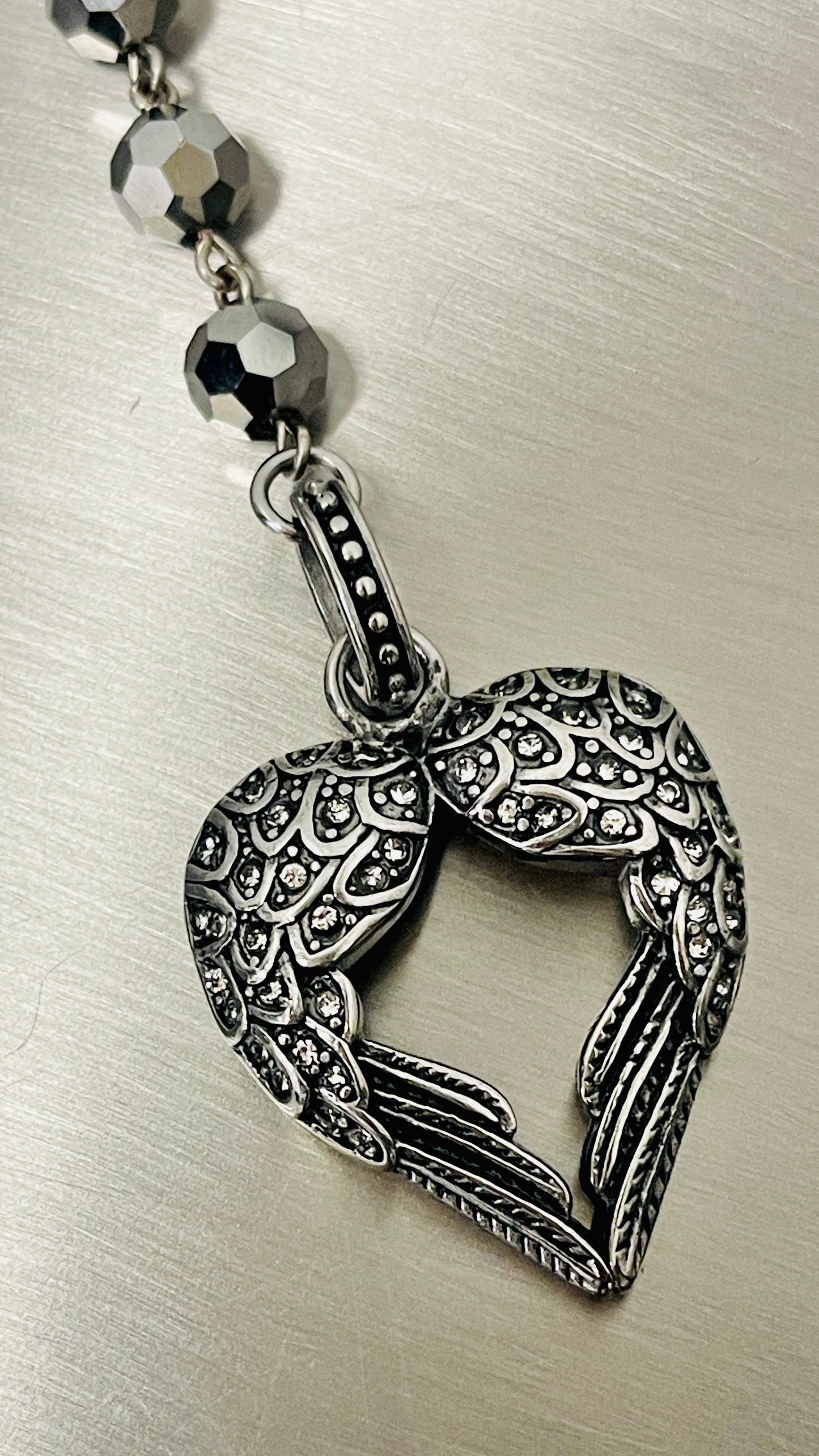 “Sacred Wings” in Gunmetal